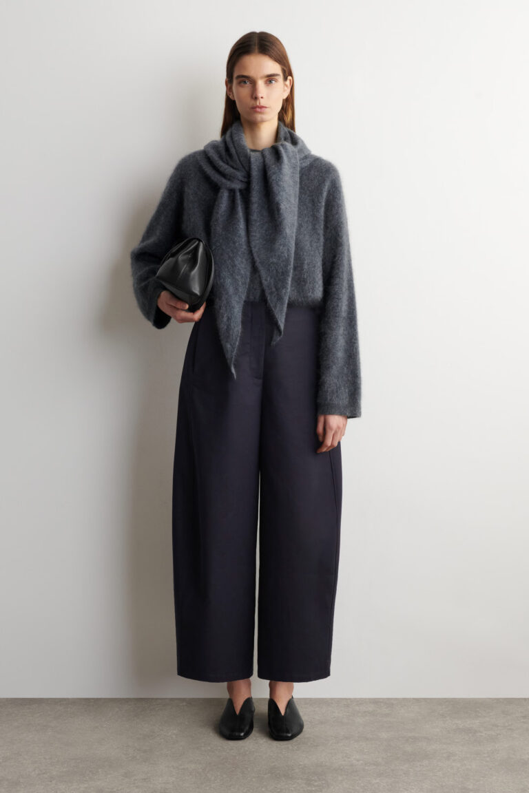 Women in cropped barrel trousers